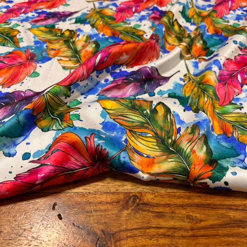 Macro close-up of قماش ستان حرير مشجر fabric on a wooden table